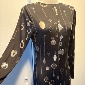 Long sleeve. Chain design dress